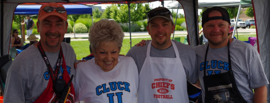 3 guys and a grandma smiling at the camera